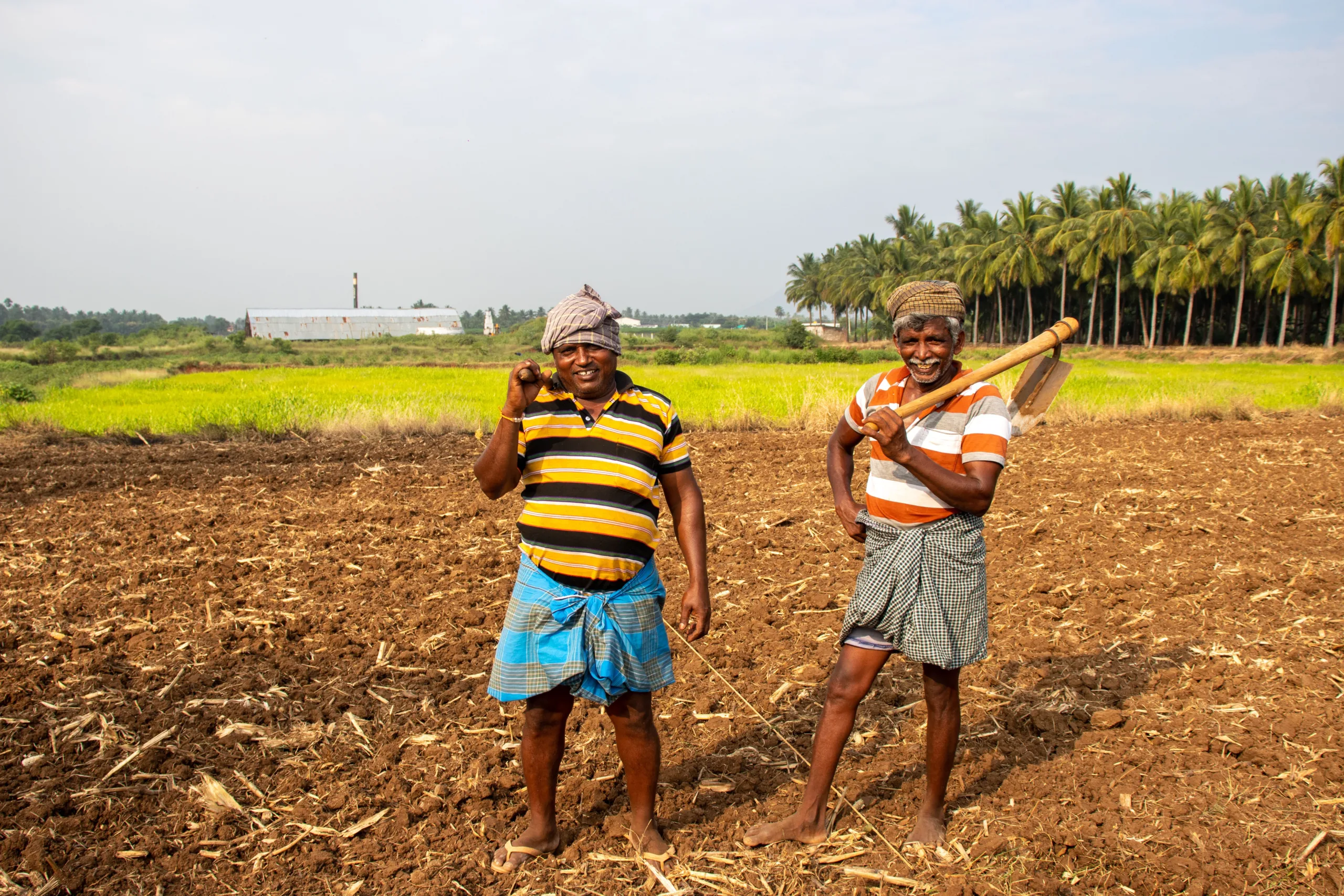 Smiling Farmers in Field